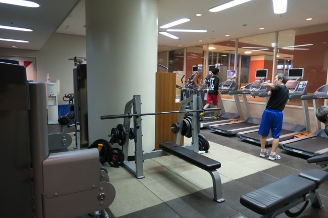 a man taking a selfie in a gym