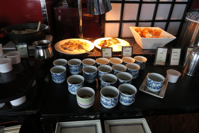 a table with cups and plates on it