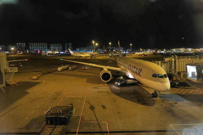 an airplane on the tarmac at night