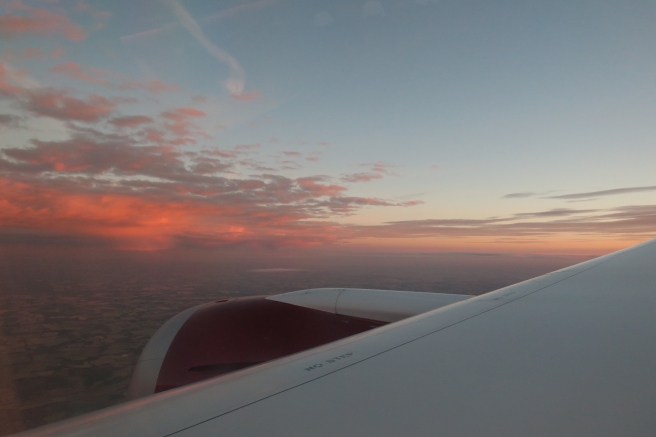 an airplane wing and sky