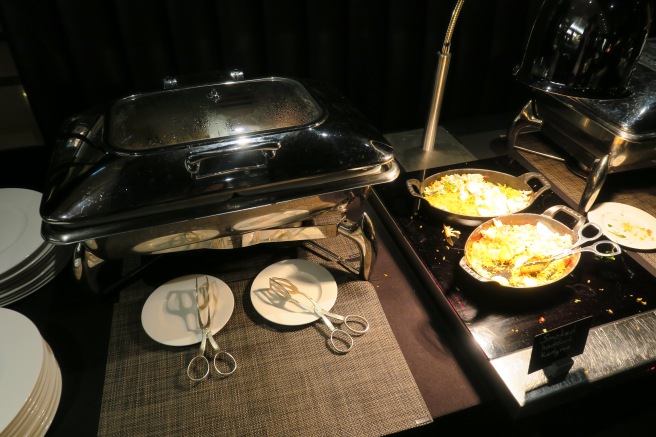 food on a table with plates and scissors