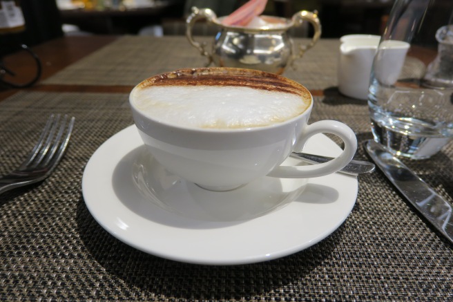 a cup of coffee on a plate