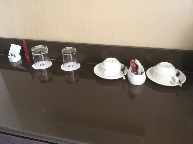 a group of cups and saucers on a counter