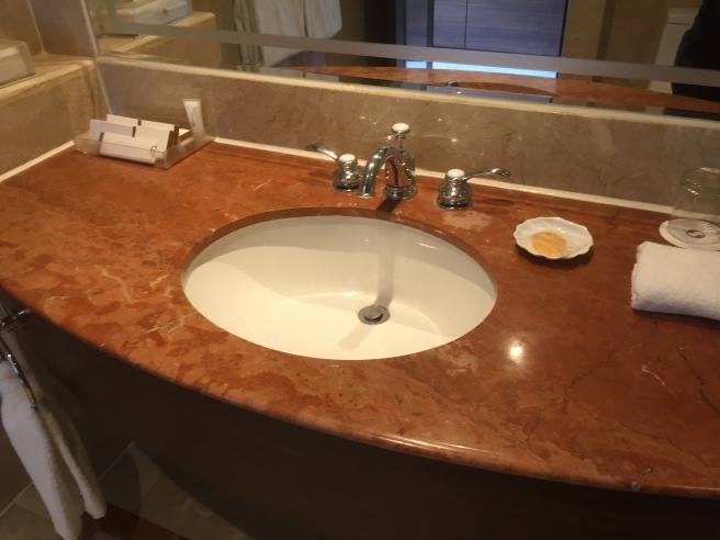 a sink with a plate on the counter