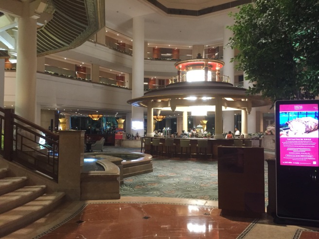 a large building with a large staircase and a large fountain