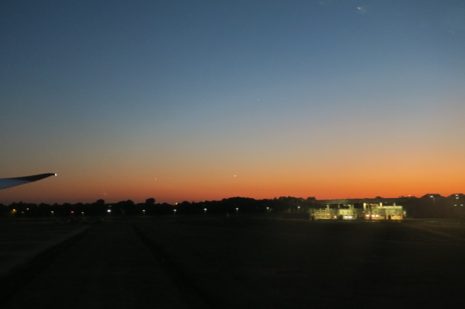 a sunset over a field