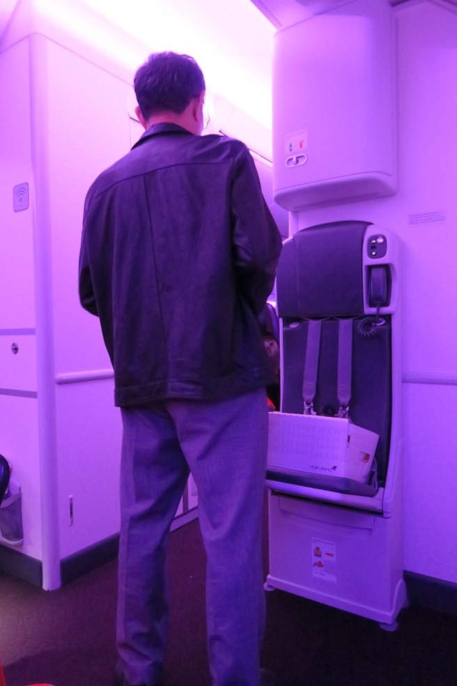 a man standing in an airplane