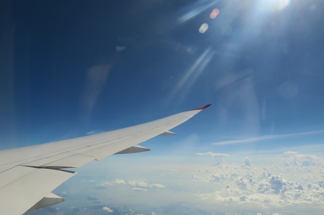 the wing of an airplane in the sky