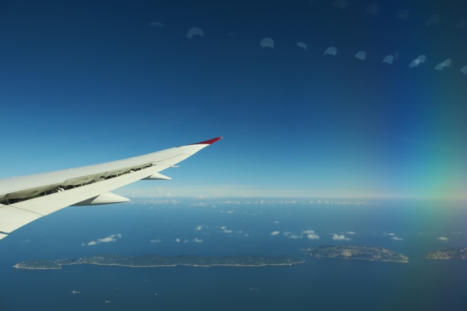 an airplane wing and land in the sky