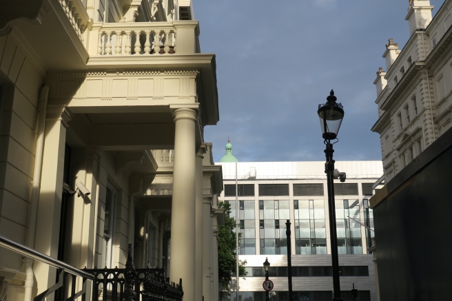 a building with columns and a gate