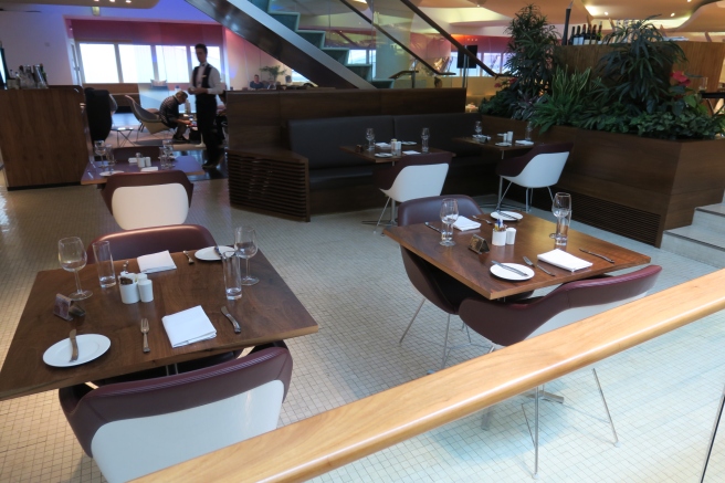 a restaurant with tables and chairs