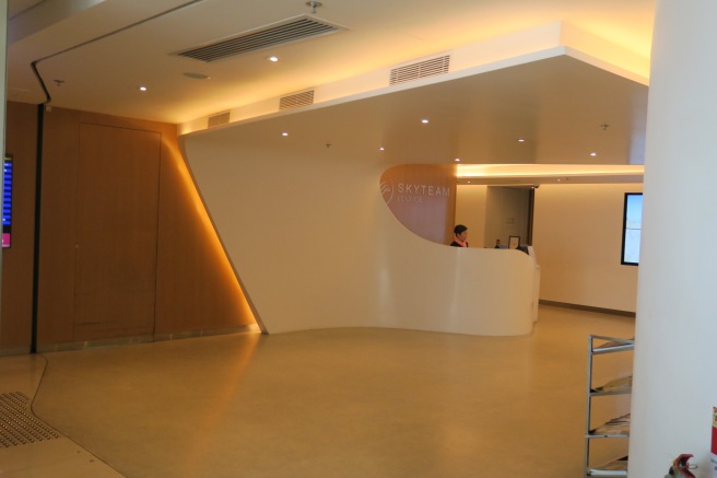 a person standing at a reception desk