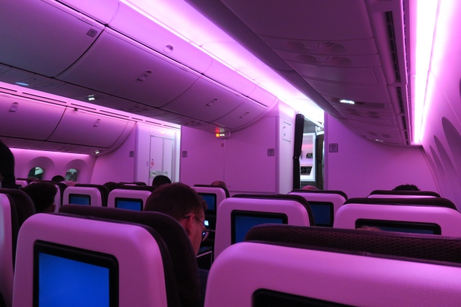 a group of people sitting in an airplane