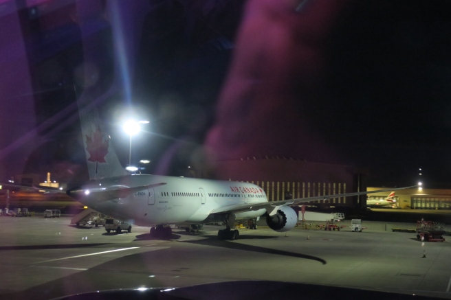 a plane on the runway at night