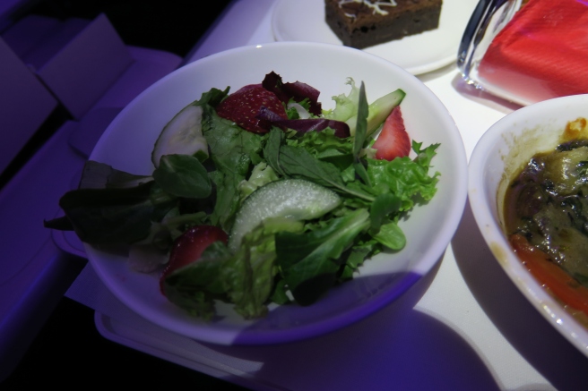 a bowl of salad on a table