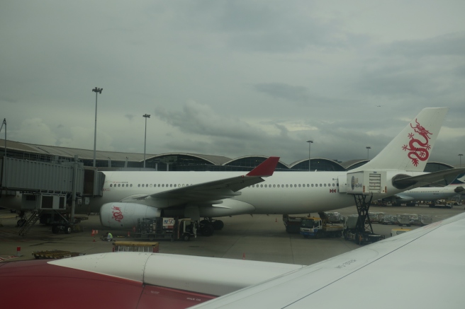 a white airplane at an airport