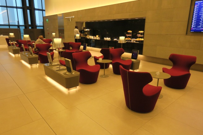 a room with red chairs and tables