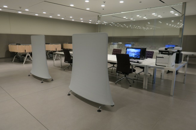 a room with a white table and chairs