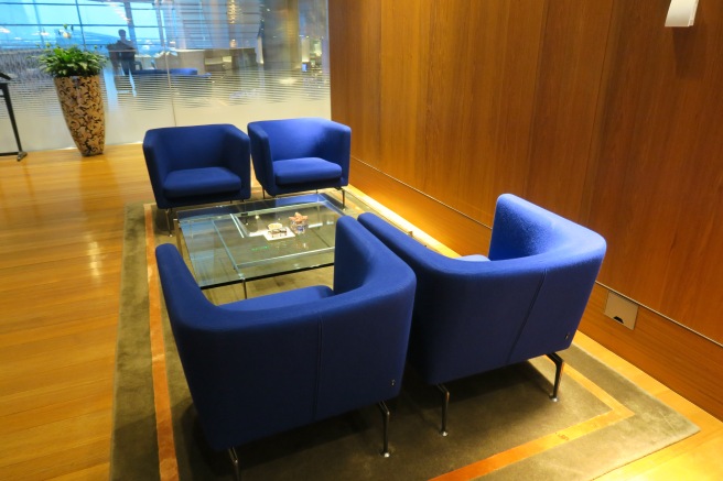 a group of blue chairs in a room