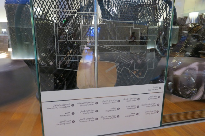 a glass wall with a sign