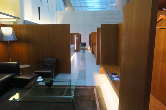 a room with wood partitions and a coffee table