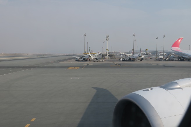 a group of airplanes on a runway