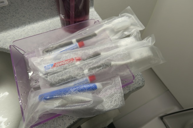 a group of toothbrushes in plastic bags