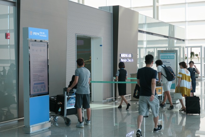 a group of people walking in an airport