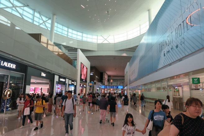 a group of people walking in a mall