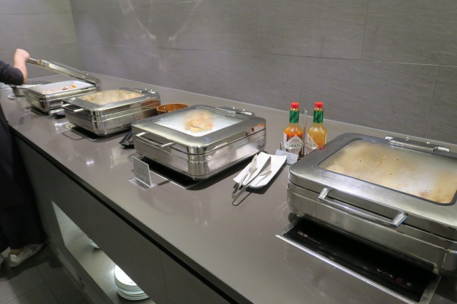 a row of food containers on a counter