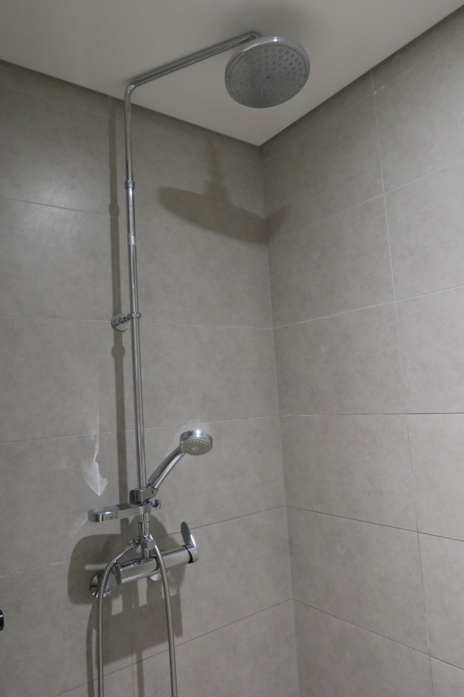 a shower head in a bathroom