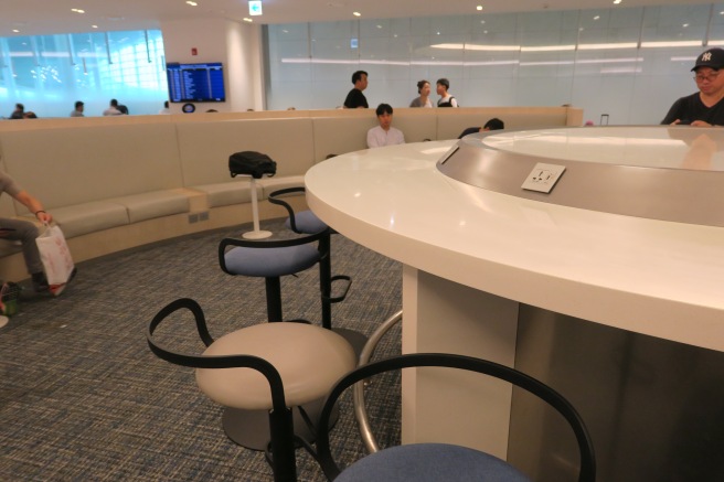 a group of people sitting around a round table