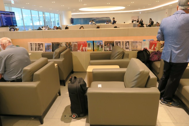 a group of people sitting in a waiting room