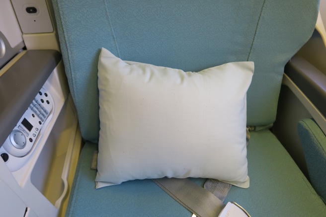 a white pillow on a seat