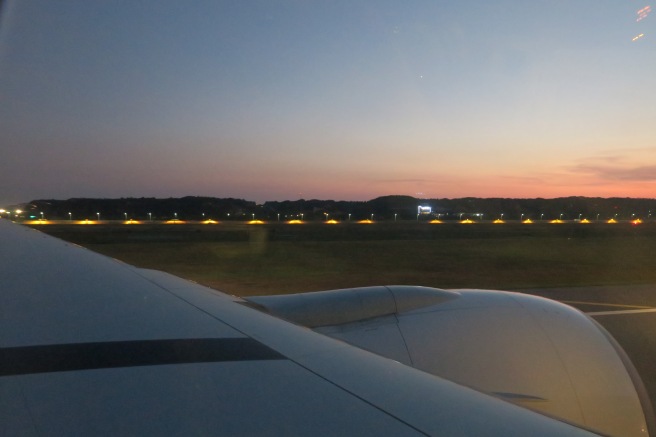 an airplane wing with lights on the side