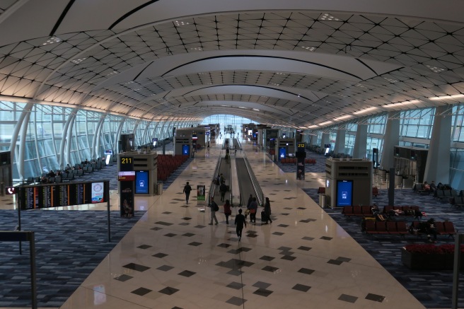 a group of people walking in an airport