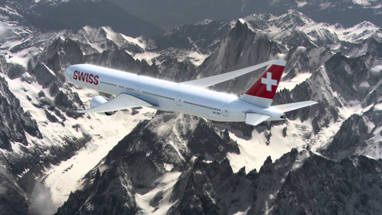 a plane flying over mountains