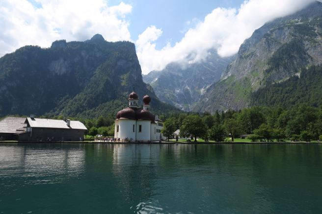 a building next to a body of water