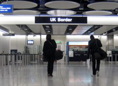 a group of people walking in a airport