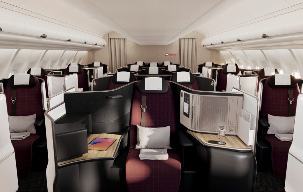 a interior of an airplane with rows of seats