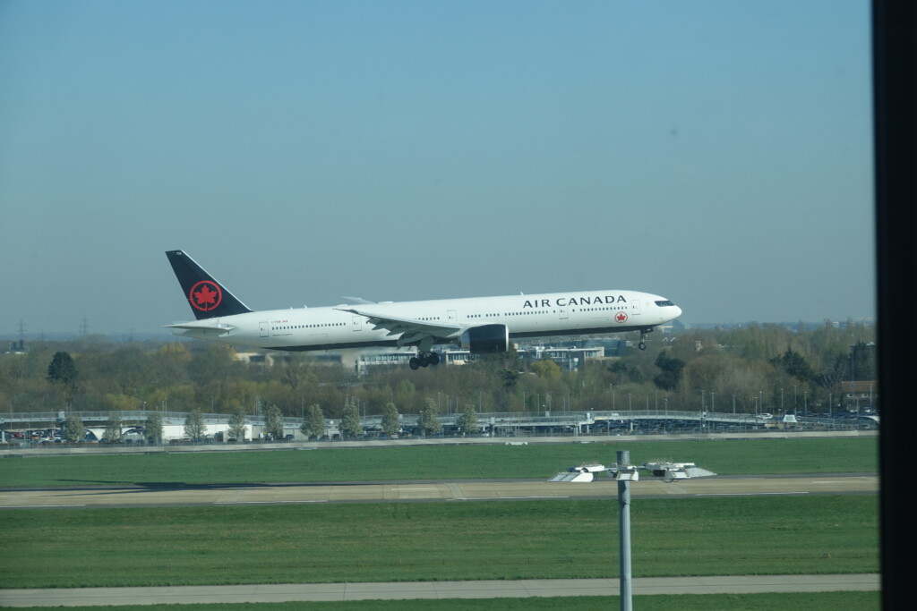 a large white airplane taking off