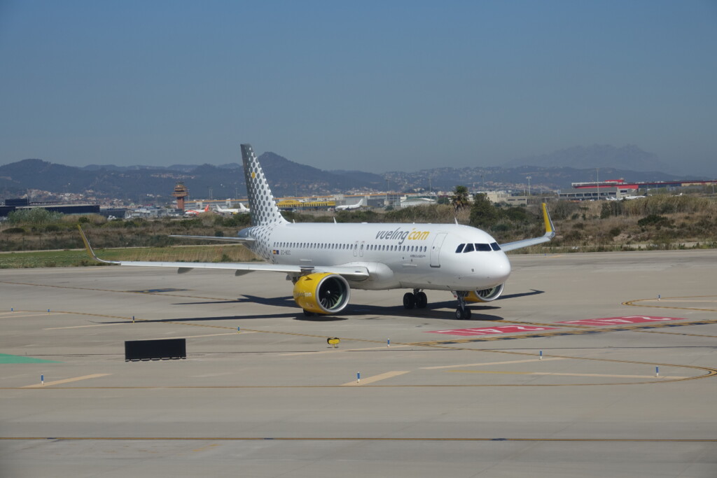 a white airplane on a runway