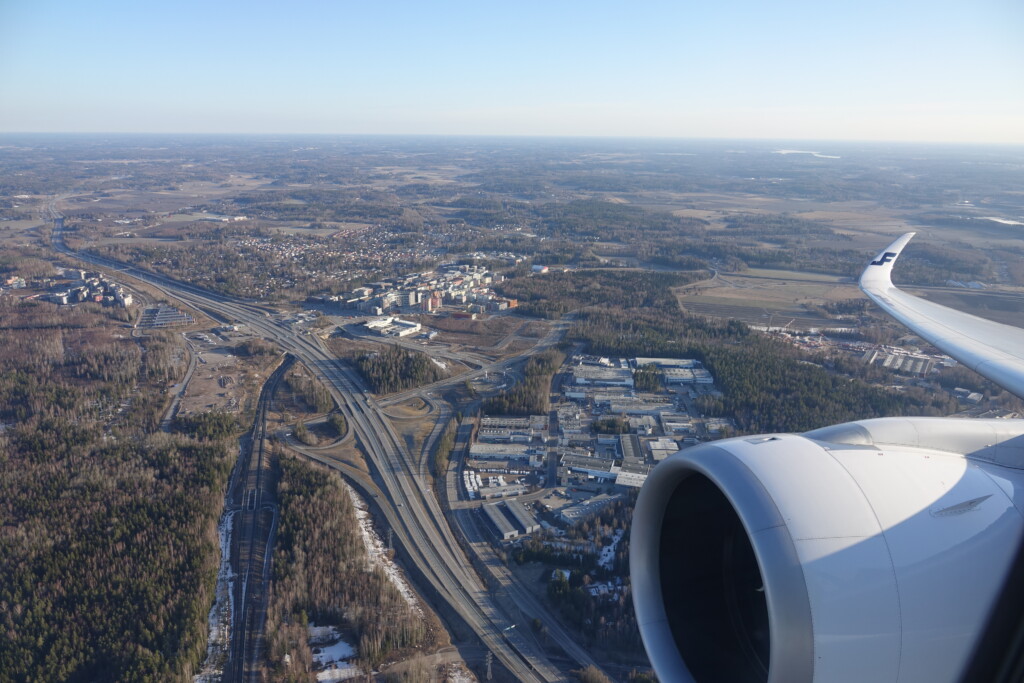 an airplane wing and a city