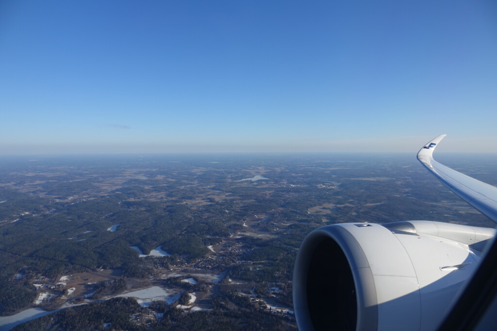 an airplane wing and a landscape