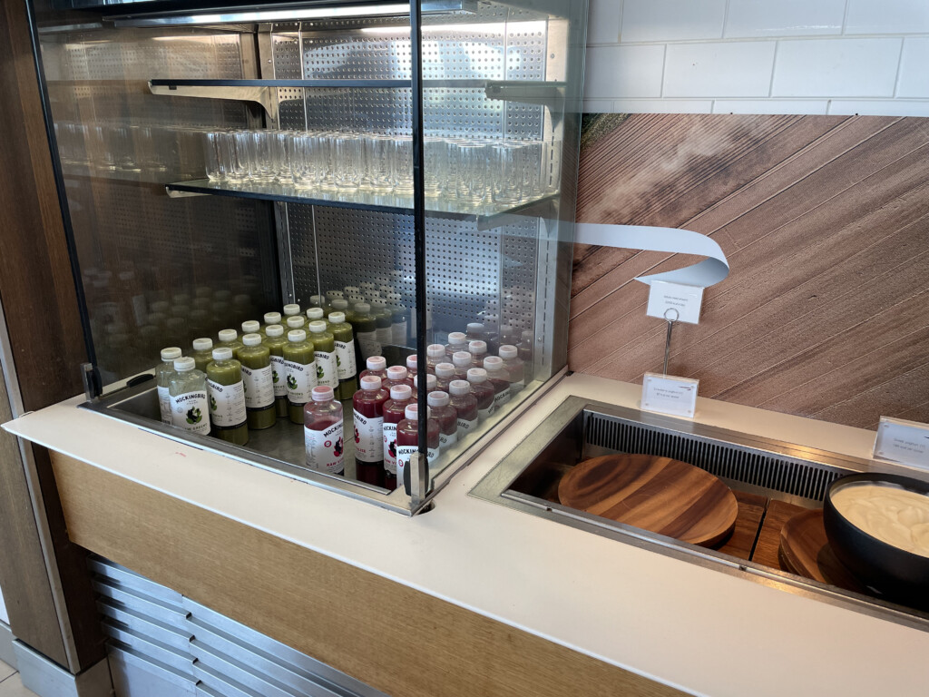 a display case with bottles and glasses