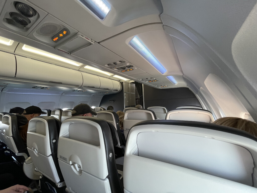 a group of people sitting in an airplane