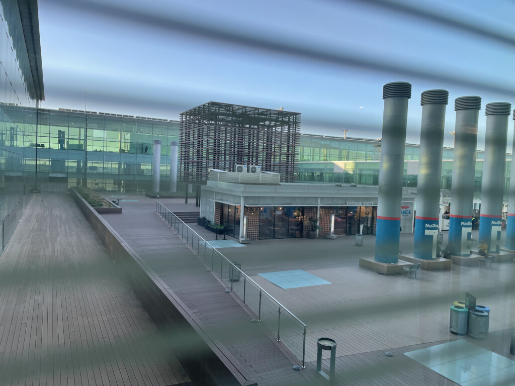 a building with a glass wall and a railing