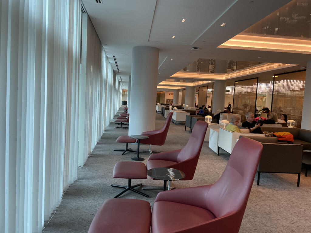 a room with red chairs and tables