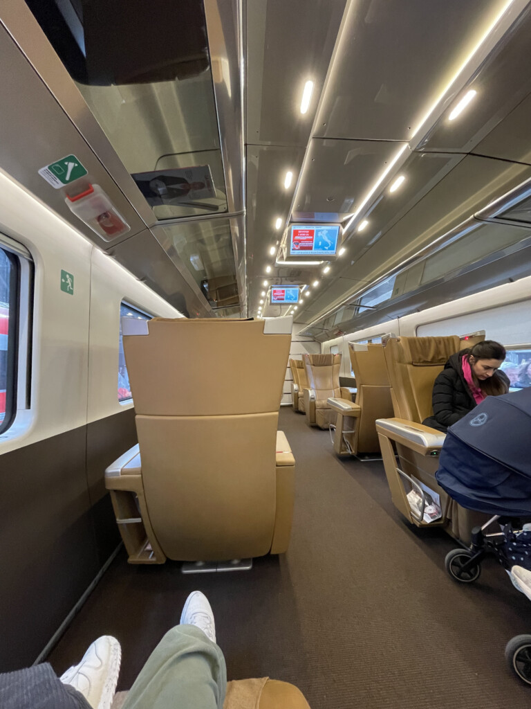 a person sitting in a chair on a train