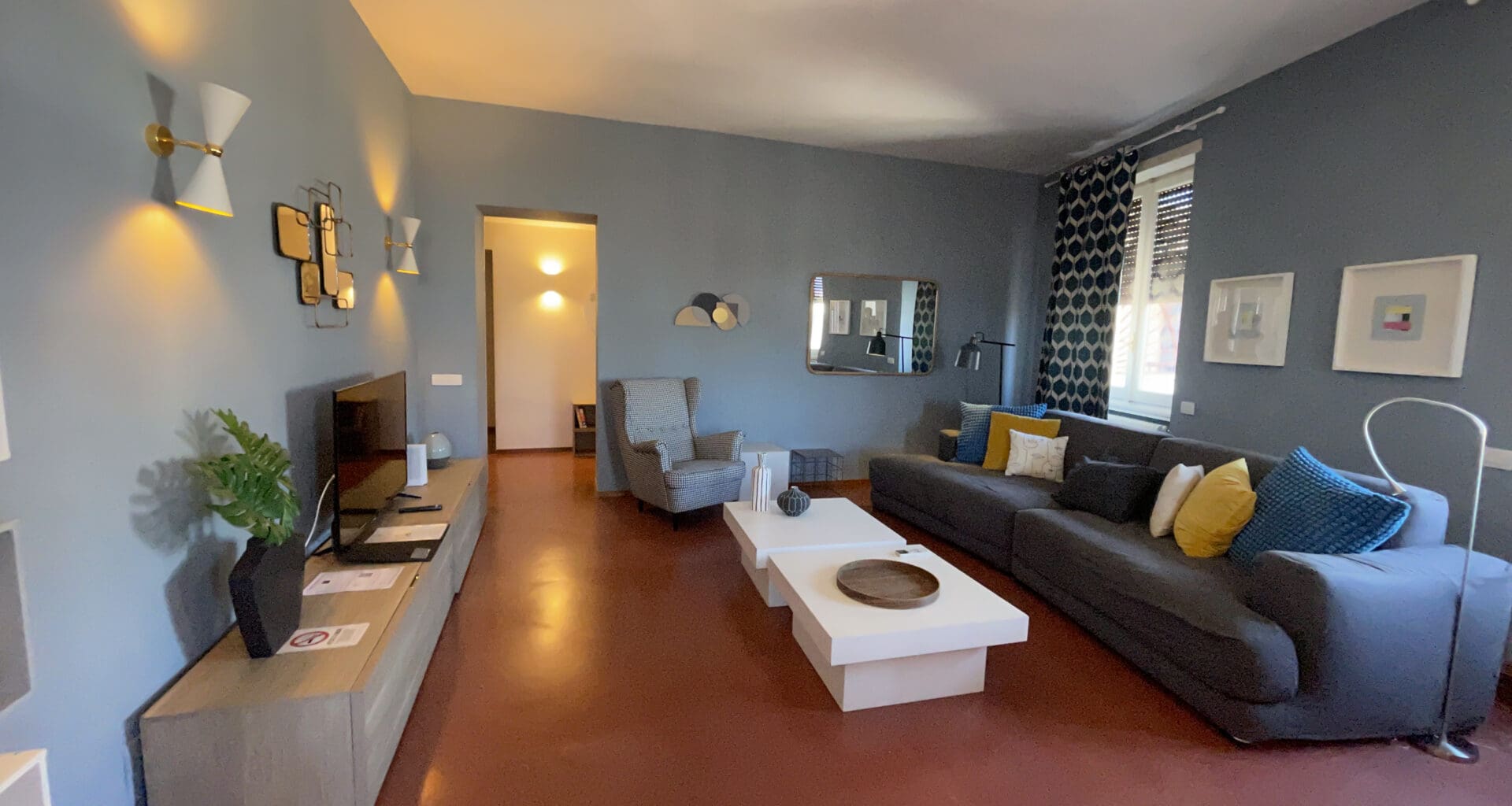 a living room with a couch and a tv